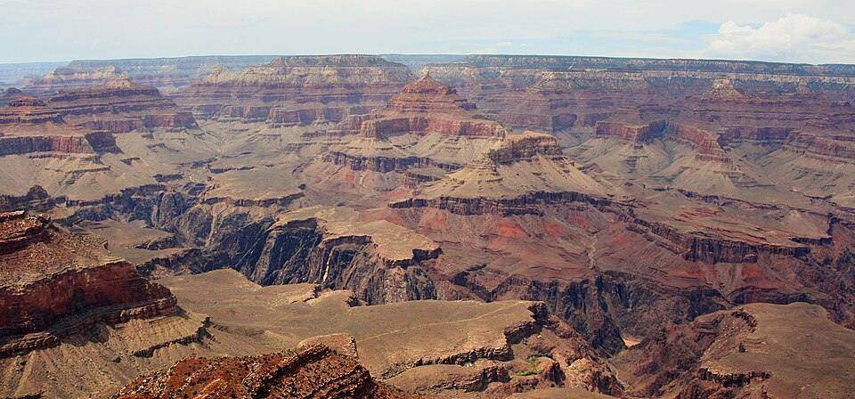 Grand Canyon layered sedimentary walls cut by the Colorado River.