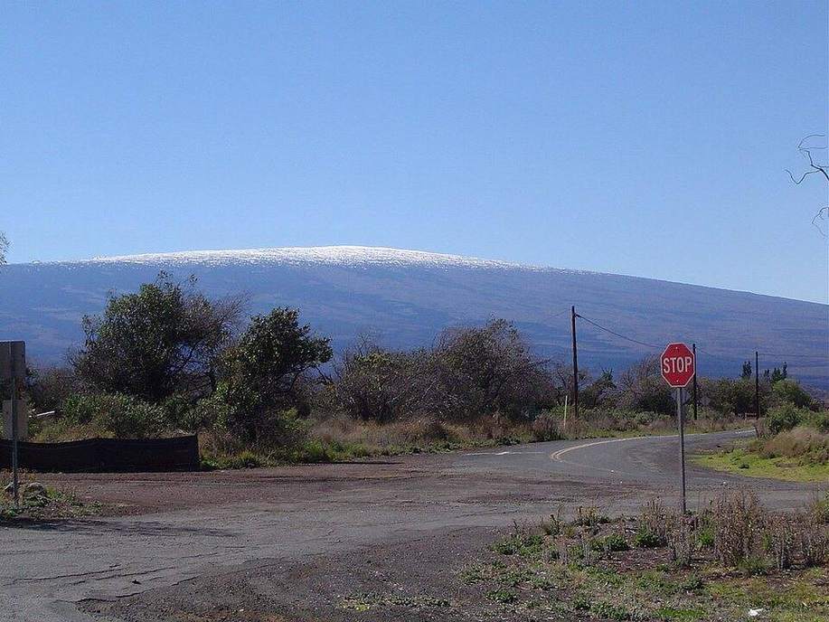 A broad shield volcano of stacked basalt.