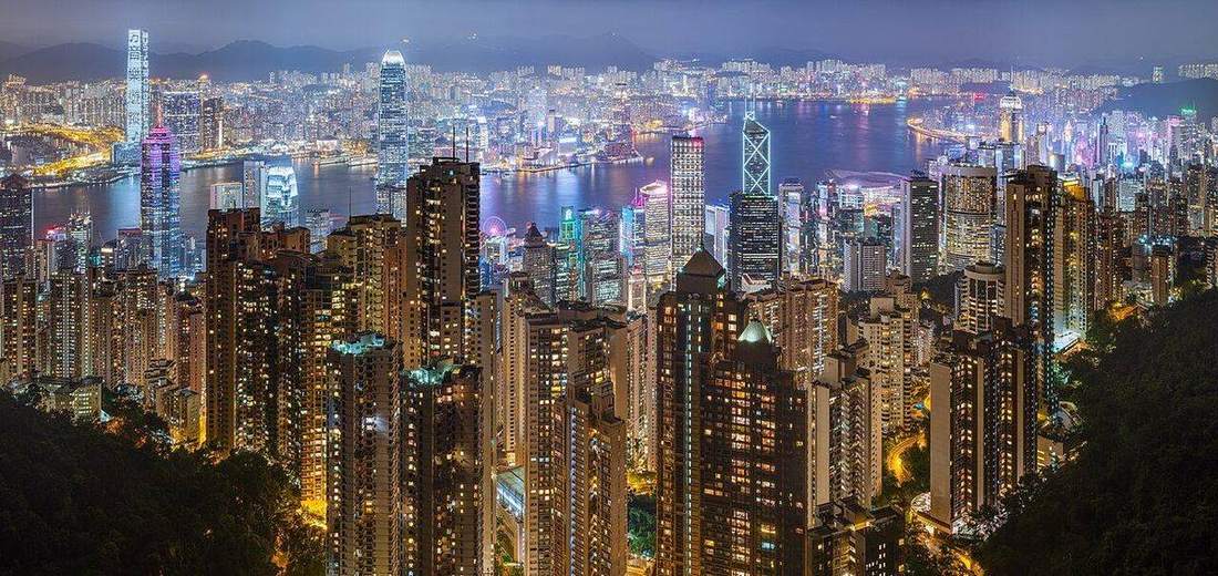 Hong Kong Island: steep weathered slopes above a dense city.