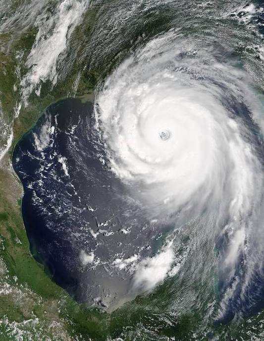 Satellite view of a tropical cyclone with a clear eye.