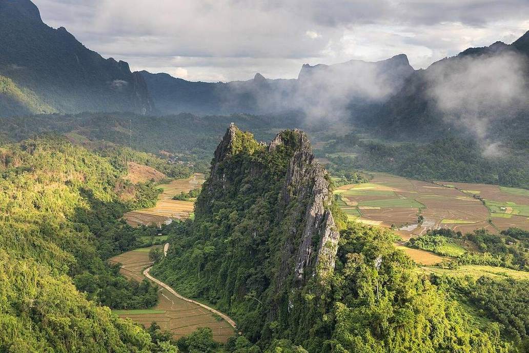 Tower karst or a cave in carbonate rock.