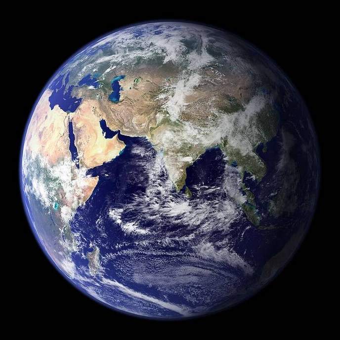 Earth from orbit with a sharp day-night terminator.