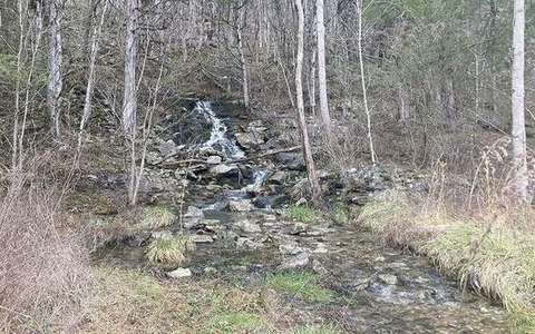 hydraulic action in the river-erosion lab — a TERMS crop, not the glossary plate and not the lab cover.